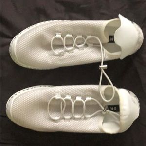 Women’s DKNY white slip on sneakers